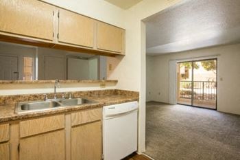 a kitchen with a dishwasher sink and counter top